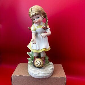 VTG HOMCO PORCELAIN FIGURINE - YOUNG GIRL OBSERVING A SNAIL ON LEAFY BASE